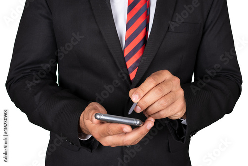 A businessman scrolling and checking emails with touchpen on mobile phone. photo