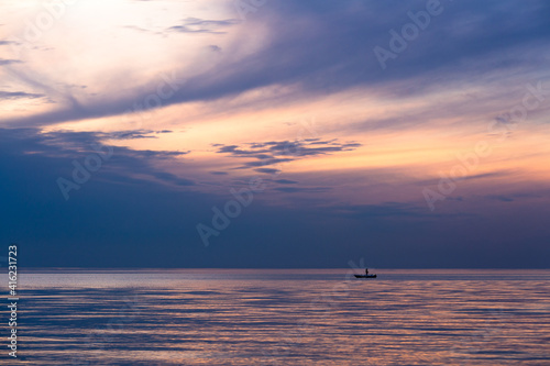 Boat in the sea with dark clouds