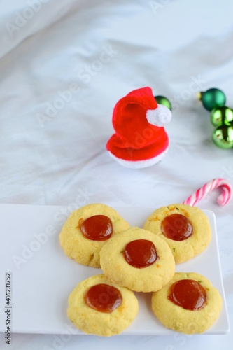 Thumbprint cookies on white background with Christmas decoration 