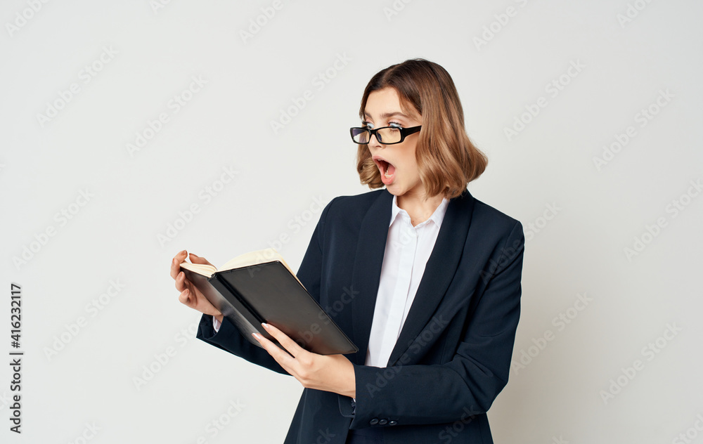 Business woman with documents on a light background portrait suit finance Business woman with documents on a light background portrait suit finance