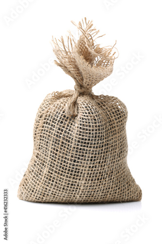 Hessian sack with ties forming over white background