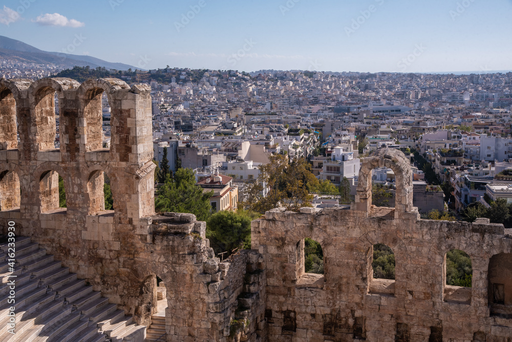 Ancient Odeon of Herodes Atticus theater - amphitheater of Acropolis of Athens, Greece.Landmark of Greece. Scenic view of Ancient Greek ruins overlooking Athens city.