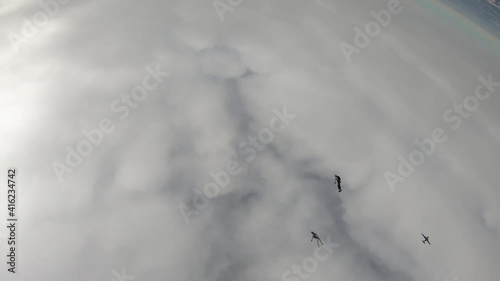 Skydiving. SKydiver are flying in the cold sky.