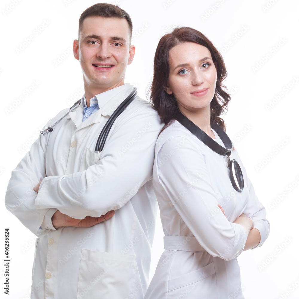 Confident Professional Caucasian Doctors in White Smocks With Endoscope and Examination Mirror Posing Together Confident Professional Caucasian Doctors in White Smocks With Endoscope and Examination Mirror Posing Together