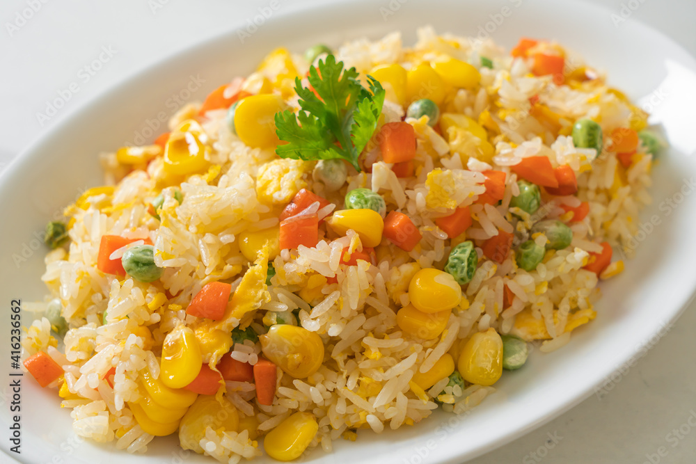 fried rice with mixed vegetable (carrot, green bean peas, corn) and egg fried rice with mixed vegetable (carrot, green bean peas, corn) and egg