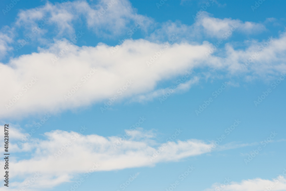 Fototapeta premium White clouds in blue sky.Winter clouds blue heaven background.