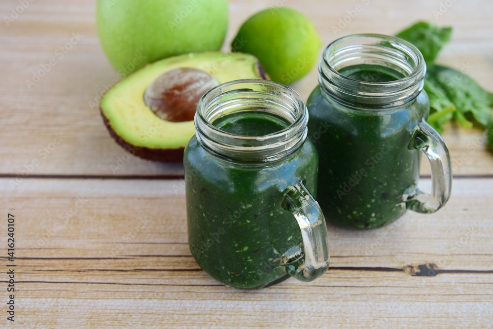 Green smoothie with spirulina, spinach, avocado and apple Green smoothie with spirulina, spinach, avocado and apple
