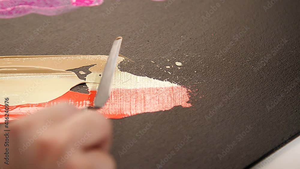 Artist s Hand Draws With A Palette Knife Process Of Acrylic Drawing artist-s-hand-draws-with-a-palette-knife-process-of-acrylic-drawing