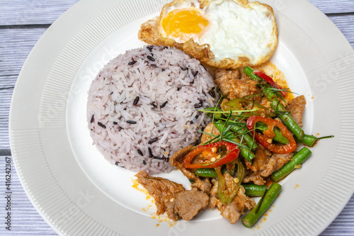 Rice with Stir Fried Chili, Pork, Fried Egg, Delicious. It is a popular for Thai Food 