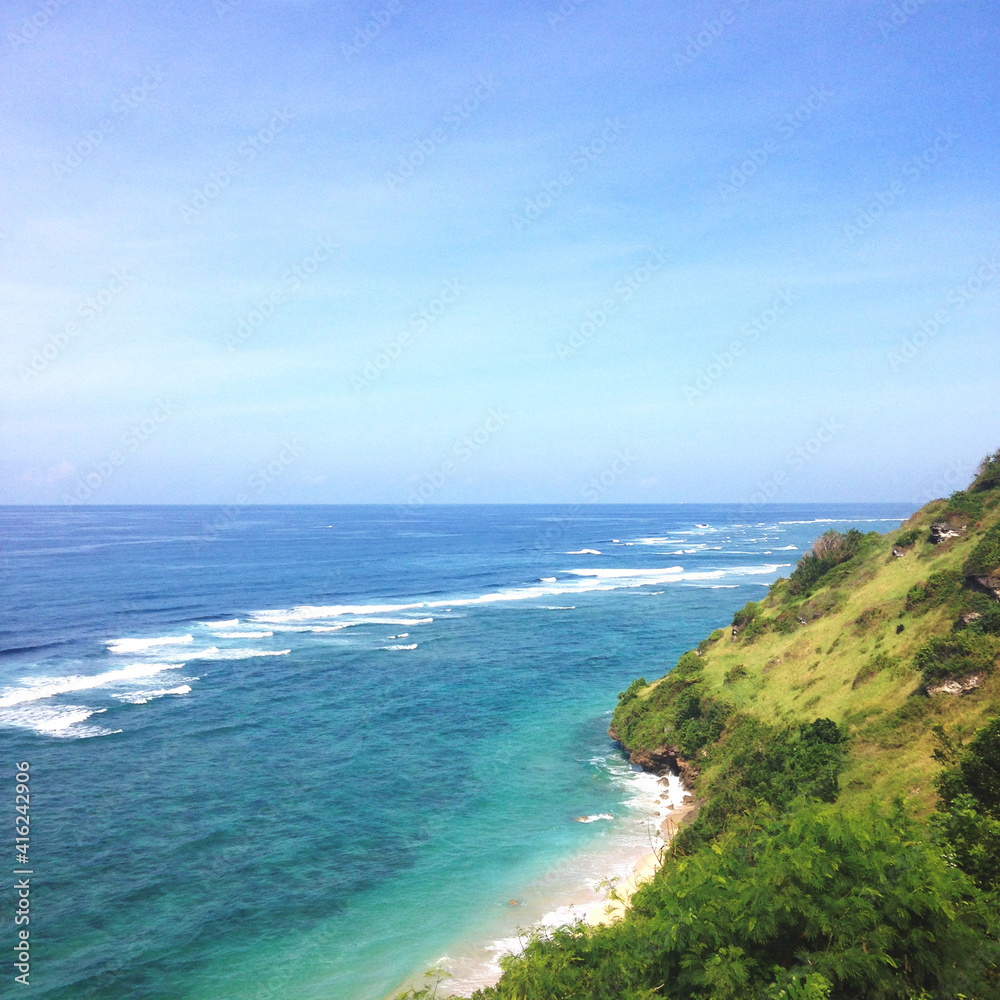 Stunning view, crystal clear blue water & white sand beach at Gunung Payung Beach Bali Indonesia