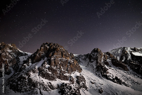 Snow Mountains at night sky with stars