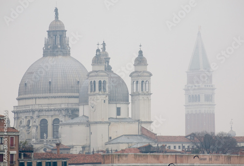 Venice view of the domes of churches and bell towers in the mist of a winter