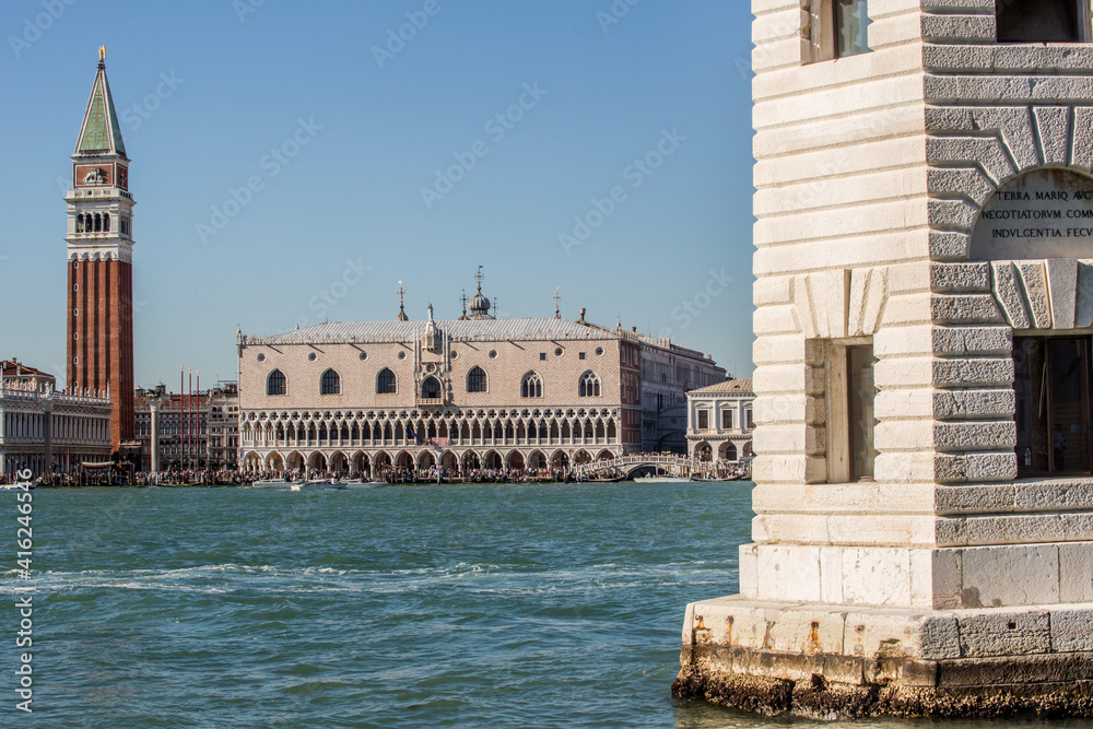Venice view of Doge's Palace and the bell tower of Piazza San Marco from the island of San Giorgio