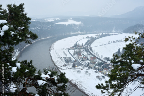 River Elbe and view to Rathen at the Elbsandsteingebirge in Winter