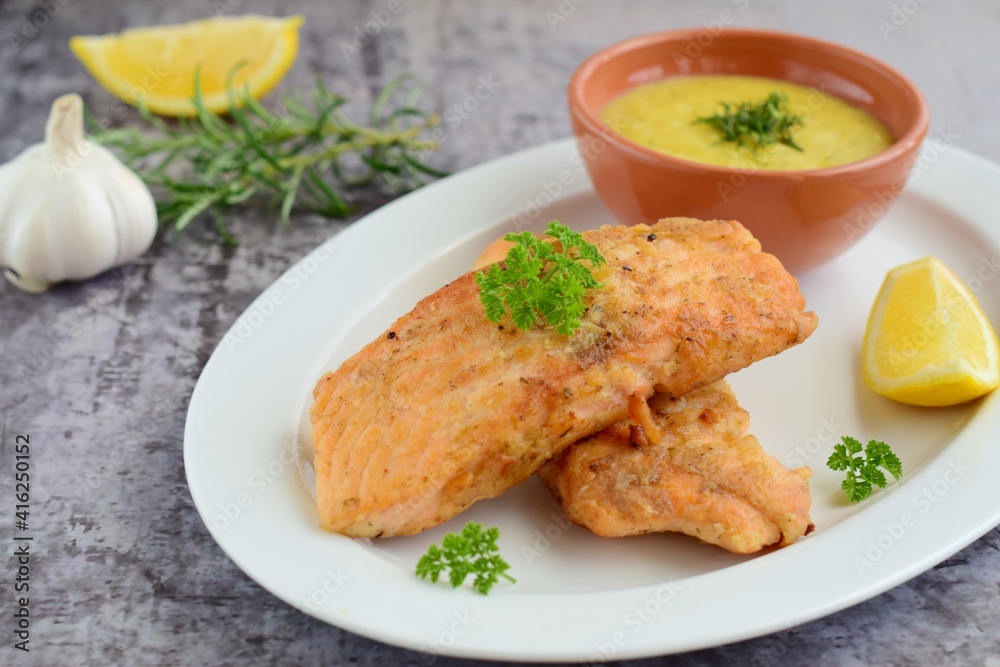 Fried salmon with potato puree with parsley and lemon Fried salmon with potato puree with parsley and lemon