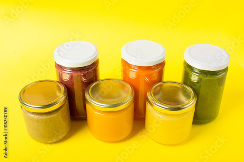 various kinds of baby food in jar, top view