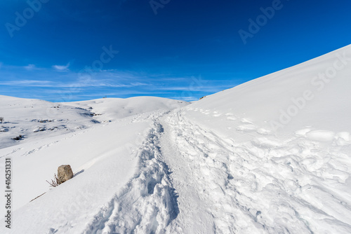 Snowy landscape in winter on the Lessinia Plateau (Altopiano della Lessinia) and peak of Monte Tomba, Regional Natural Park, Malga San Giorgio, ski resort in Verona province, Veneto, Italy, Europe. © Alberto Masnovo