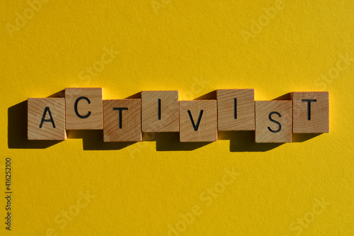 Activist, words in wooden alphabet letters photo