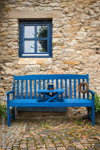 Bright blue bench and window on an historic house in Florsheim Dalsheim, Germany. photo