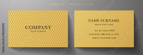 Business card with luxury abstract gold triangle pattern (golden carbon texture). Formal premium background template useful for invitation design, Gift card, voucher or gift coupon