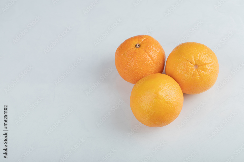 Fresh orange fruits isolated on a white background Fresh orange fruits isolated on a white background