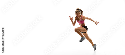 Fototapeta Naklejka Na Ścianę i Meble -  Flyer. Caucasian professional female athlete, runner training isolated on white studio background. Muscular, sportive woman. Concept of action, motion, youth, healthy lifestyle. Copyspace for ad.