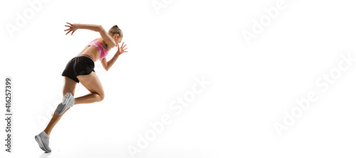 Flyer. Caucasian professional female athlete, runner training isolated on white studio background. Muscular, sportive woman. Concept of action, motion, youth, healthy lifestyle. Copyspace for ad. © master1305