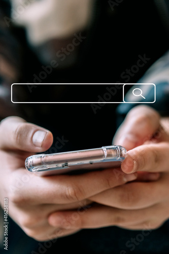 Woman's hands looking at the phone with search bar in the center of the image