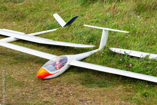 Flying model plane with dummy pilot used for aeromodelling photo