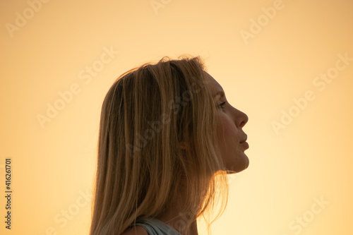 close-up of a woman on sunset photo