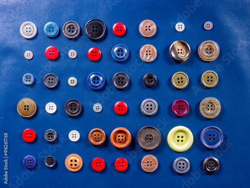 Buttons for clothes, different in color, shape, style, materials and manufacturing techniques
