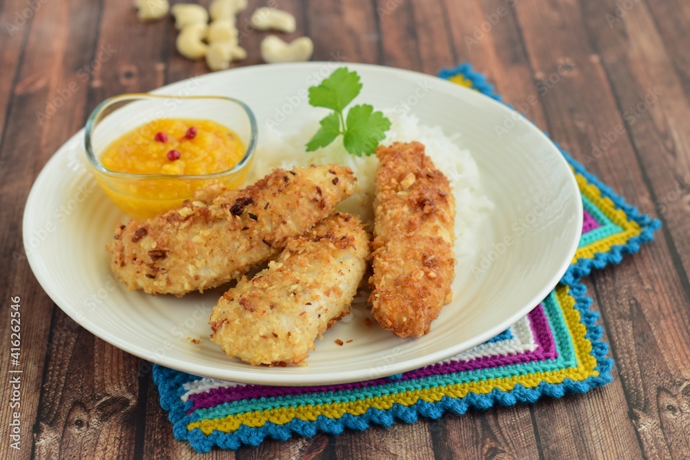 Chicken fingers breaded with cashew nuts and coconut flakes. Served with mango dip and steamed rice