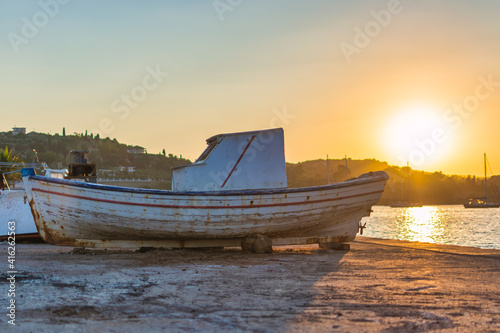 Old fishing boat at sunset