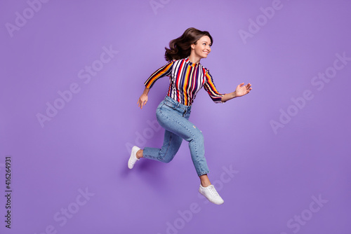 Full length body size photo of pretty girl jumping up running fast on sale isolated on vivid purple color background