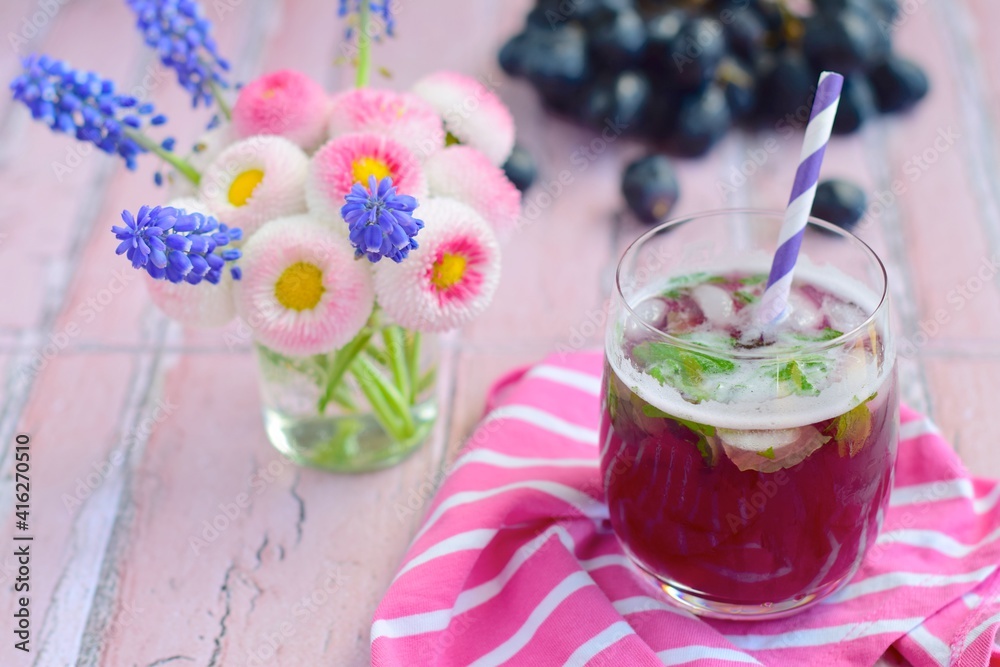 Grape mint soda mocktail with fresh grapes background Grape mint soda mocktail with fresh grapes background