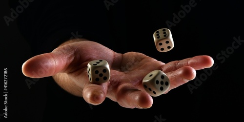 Female hand throwing dice in the air on black background. Fortune concept playing dice. luck concept. lucky man