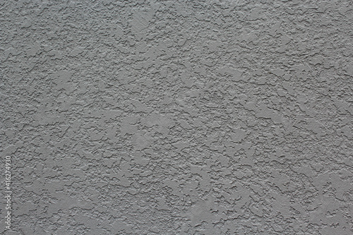 Gray cracked smooth wall background. Horizontal image