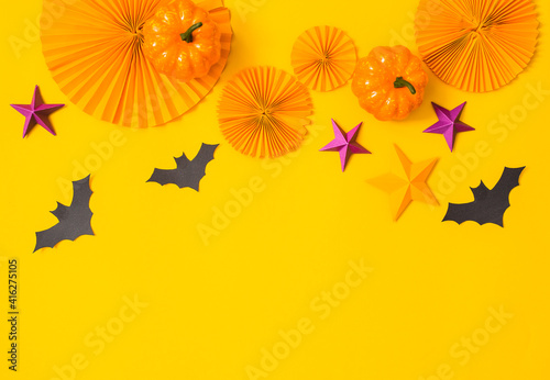 Halloween paper orange and purple craft flat lay.Children seasonal art table top view.Kids hand craft concept.Bright halloween background.