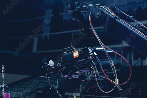 TV camera of a crane on a football mach or concert