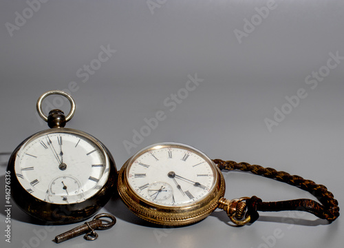 Two vintage pocket watches with key