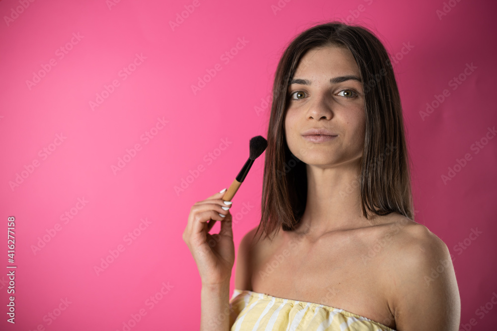woman applying mascara woman applying mascara