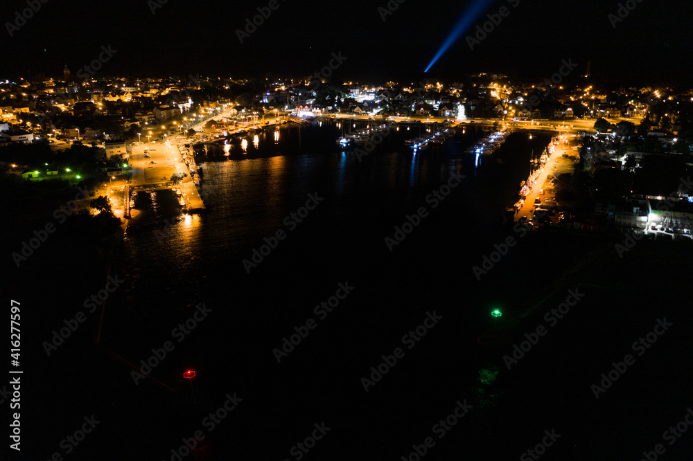 Night aerial view of marina in Jastarnia. Hel peninsula harbor in Puck Bay Baltic Sea Poland drone. Marina, harbor at night