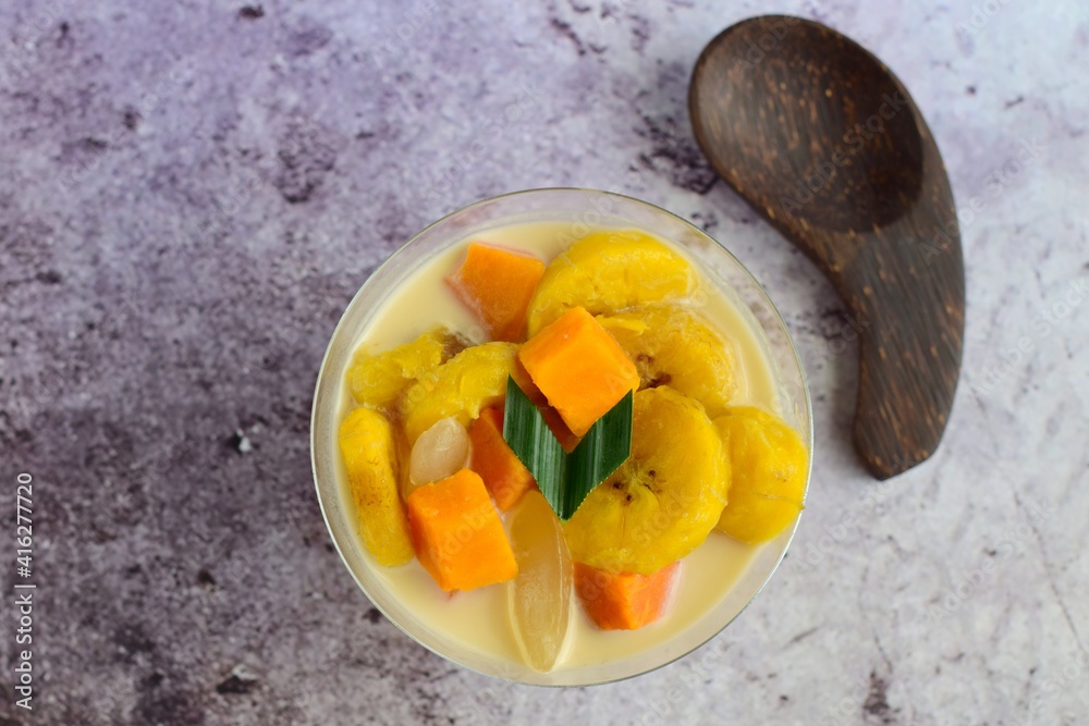 Indonesian Food - Kolak Pisang Ubi Kolang Kaling (Banana, sweet potato and palm seed). Cooked with coconut milk, palm sugar and pandanus leaves. Indonesian Food - Kolak Pisang Ubi Kolang Kaling (Banana, sweet potato and palm seed). Cooked with coconut milk, palm sugar and pandanus leaves.
