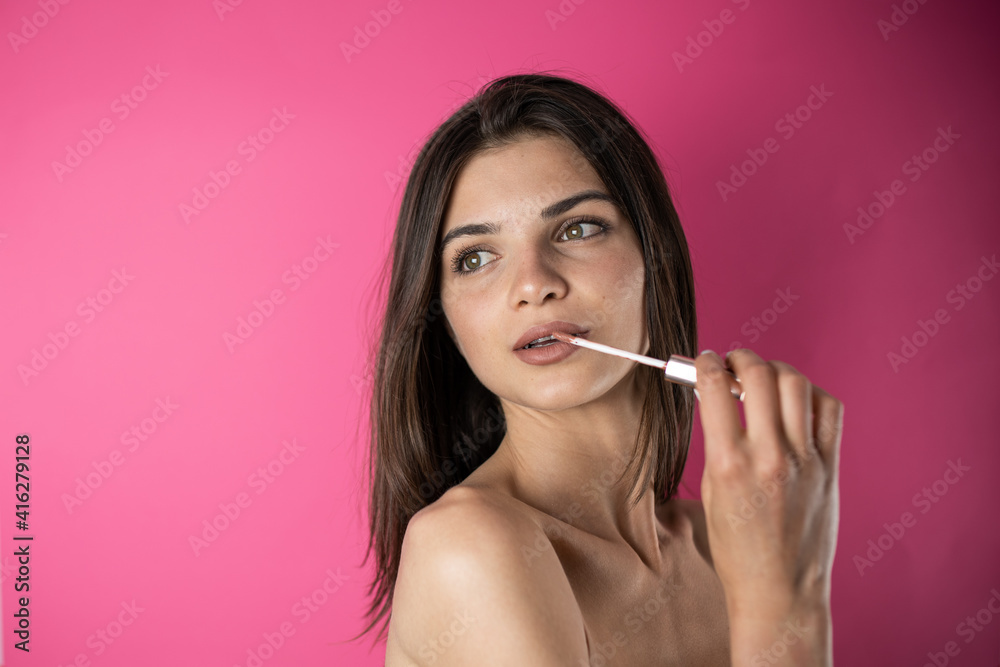 woman applying make up woman applying make up