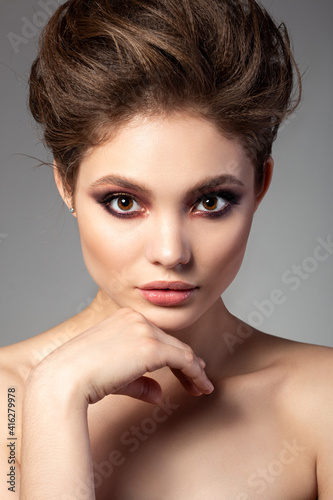Portrait of beautiful woman with evening makeup