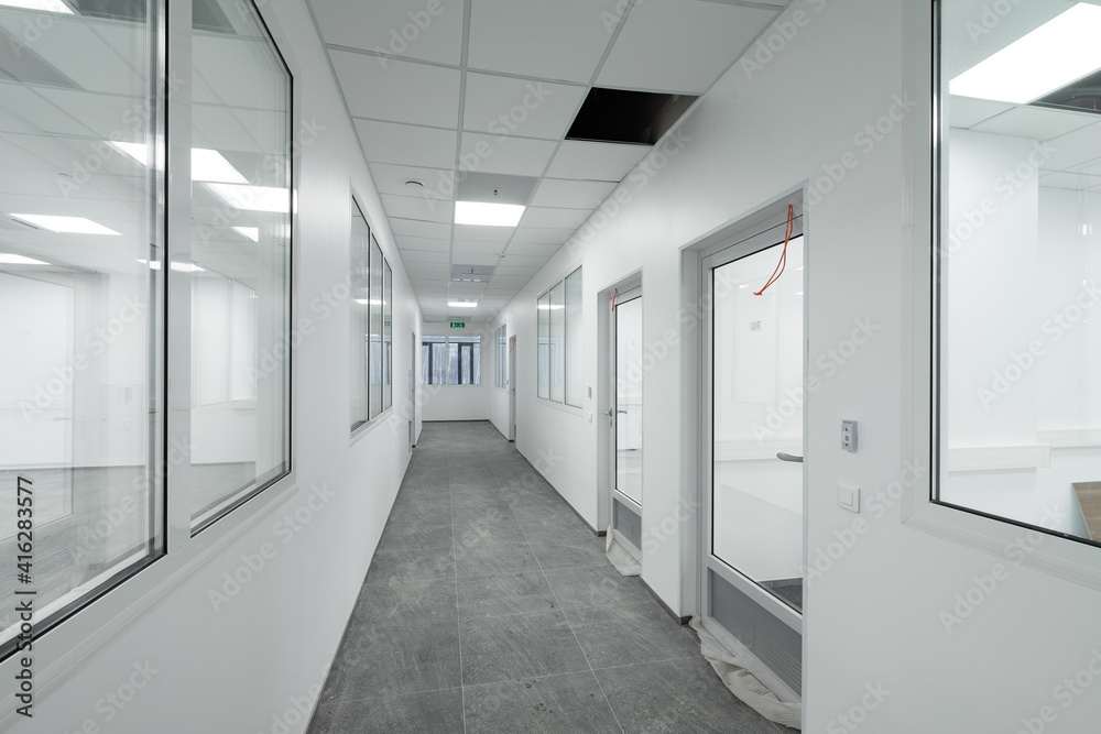 empty corridor in the modern office building. empty corridor in the modern office building.