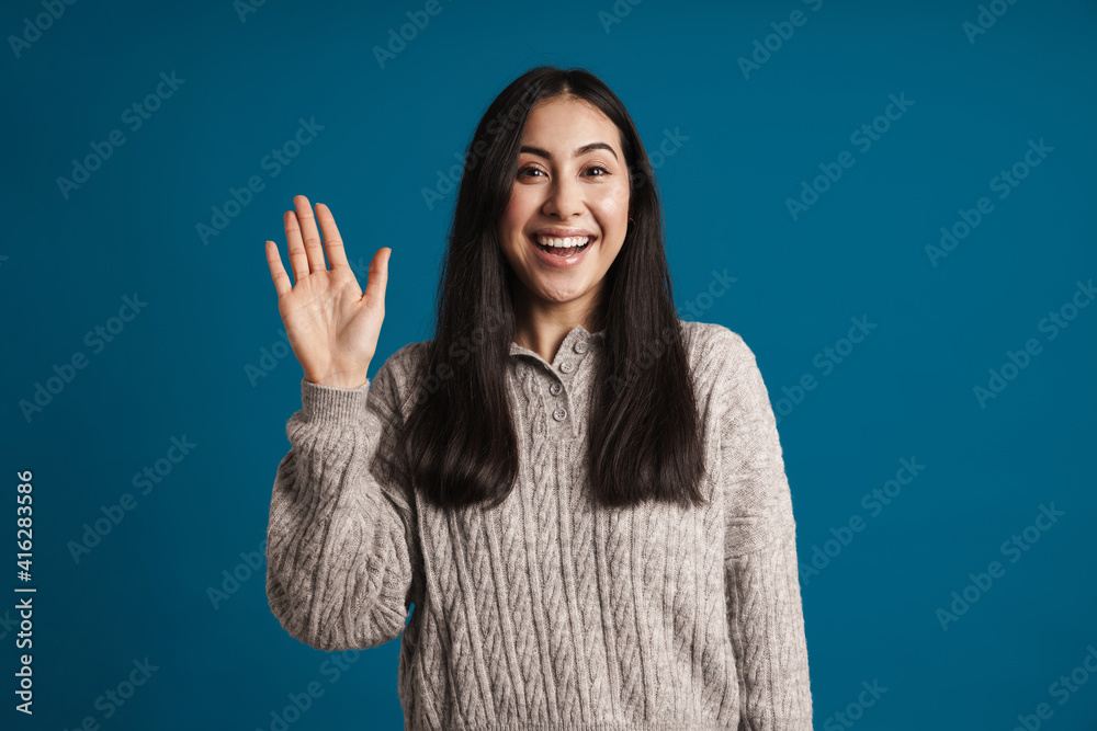 Cheerful lovely girl waving to camera isolated Cheerful lovely girl waving to camera isolated