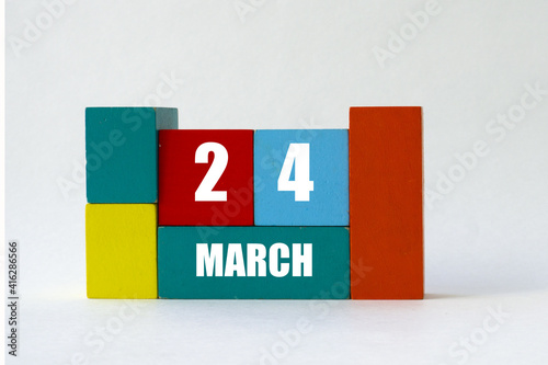 Day of month. Cube Calendar on multi-colored cubes on white background