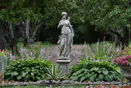 statue of a person in a garden