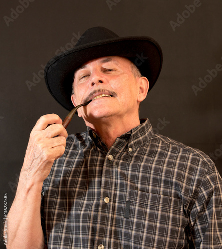 Cowboy in hat with Pipe